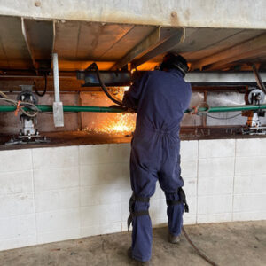 Using the Oxy-Acetylene torch to cut out an 'I' Beam.